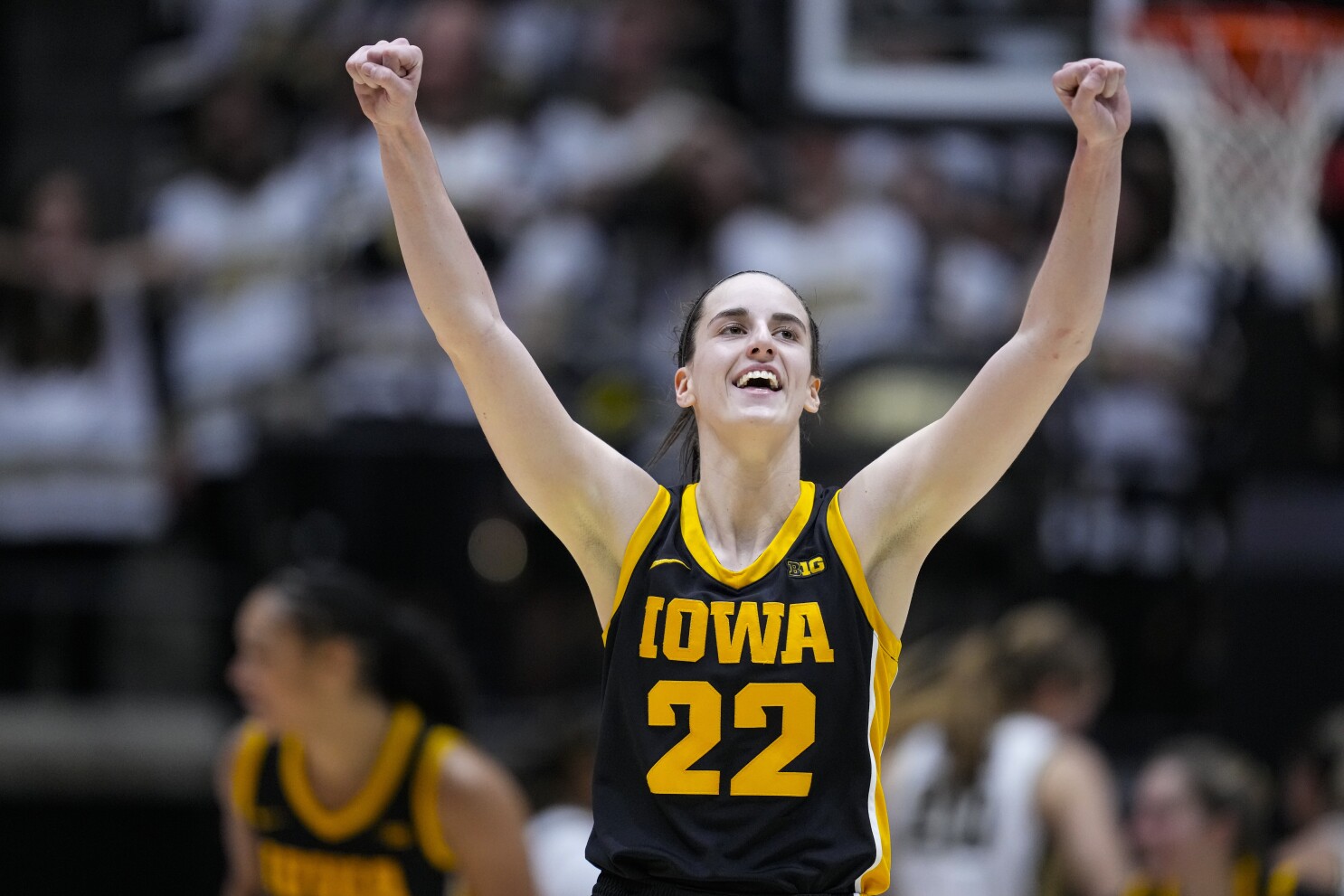 Caitlin Clark's triple-double and 3-point flurry lead No. 3 Iowa to 96-71 rout over Purdue | AP News