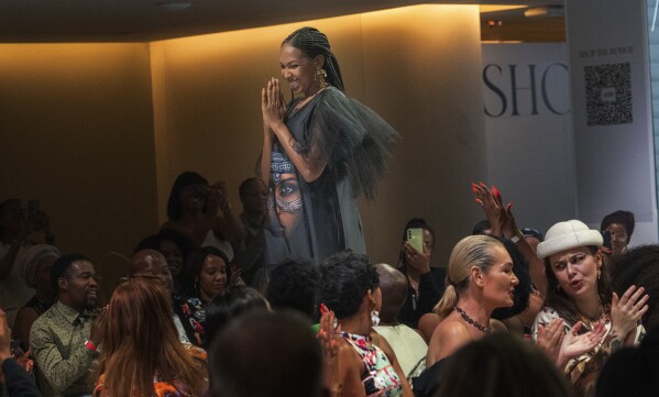Niger's designer Alia Bare thanks the public at the end of her show during Johannesburg Fashion Week 2023 in Johannesburg, South Africa, Thursday, Nov. 9, 2023. (AP Photo/Jerome Delay)