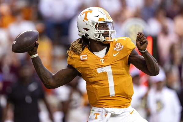 Tennessee quarterback Joe Milton III (7) looks to throw to a receiver during the second half of an NCAA college football game against Texas A&M, Saturday, Oct. 14, 2023, in Knoxville, Tenn. (AP Photo/Wade Payne)