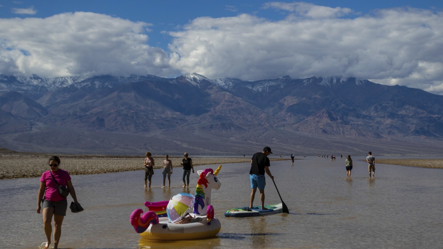 Kayakers paddle in Death Valley after rains replenish lake