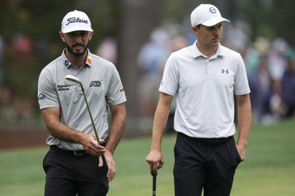 Max Homa, left, and Jordan Spieth walk in the sixth fairway during a practice for the Masters golf tournament at Augusta National Golf Club, Tuesday, April 4, 2023, in Augusta, Ga. (AP Photo/Jae C. Hong)
