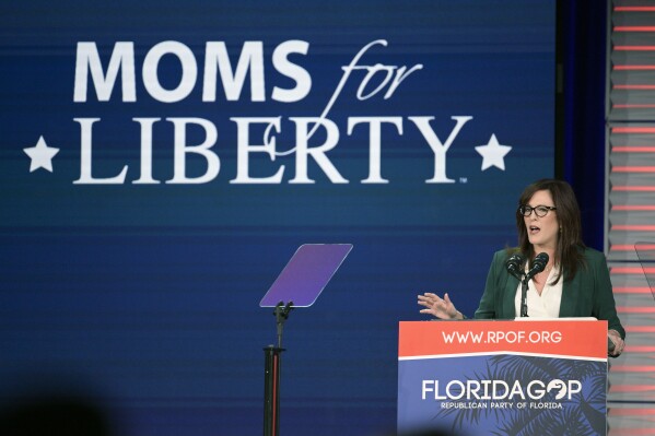 FILE - Moms for Liberty founder Tiffany Justice speaks at the Republican Party of Florida Freedom Summit, Nov. 4, 2023, in Kissimmee, Fla. Moms for Liberty has recently reported $2.1 million in total revenue in 2022. That's more than five times what the conservative “parental rights” nonprofit made in its inaugural year in 2021, according to tax filing provided to The Associated Press on Friday. (AP Photo/Phelan M. Ebenhack, File)