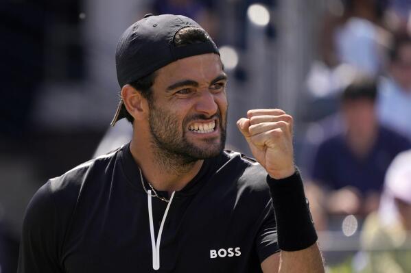 Matteo Berrettini of Italy reacts after scoring a point against Tommy Paul of the United States during their quarterfinal tennis match at the Queen's Club Championships in London, Friday, June 17, 2022. (AP Photo/Alberto Pezzali)