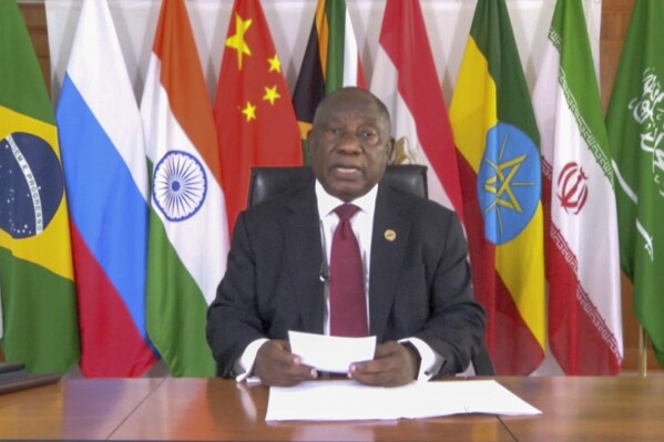 In this image made from video supplied by South Africa's Presidency, South African President Cyril Ramaphosa addresses BRICS leaders for a virtual meeting of leaders of developing countries Tuesday, Nov. 21, 2023. Ramaphosa accused Israel of war crimes, condemned Hamas for its attack on Israeli civilians that sparked the conflict and said both sides were guilty of violating international law. (South Africa Presidency via AP Photo)