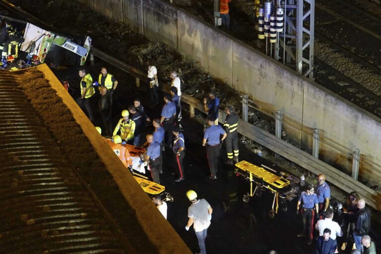 Emergency services work at the scene of a passenger bus accident near the city of Venice, Italy, that fell from an elevated road, late Tuesday, Oct. 3, 2023. Italian authorities say multiple people have been killed and others injured in the bus crash. The crash happened Tuesday when the bus fell from an elevated street in the Mestre borough on the mainland opposite the old city of Venice. (Slow Press/LiveMedia/LaPresse via AP)