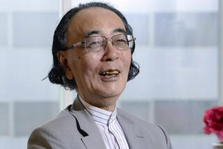 Japanese pianist and composer Toshi Ichiyanagi speaks in an interview in Tokyo, Sept. 2018. Avant-garde pianist and composer Ichiyanagi, who studied with John Cage and went on to lead Japan’s advances in experimental modern music, has died. He was 89.(Kyodo News via AP)