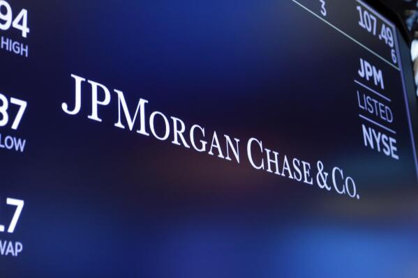 FILE - In this Aug. 16, 2019, file photo, the logo for JPMorgan Chase & Co. appears above a trading post on the floor of the New York Stock Exchange in New York. Deutsche Bank and JPMorgan Chase are asking a federal court to throw out lawsuits that claim they helped Jeffrey Epstein abuse young women and maintain his sex-trafficking ring. The banks argue they provided routine services to Epstein, and the lawsuits fail to show that they were part of Epstein’s criminal sex trafficking ring. (AP Photo/Richard Drew, File)