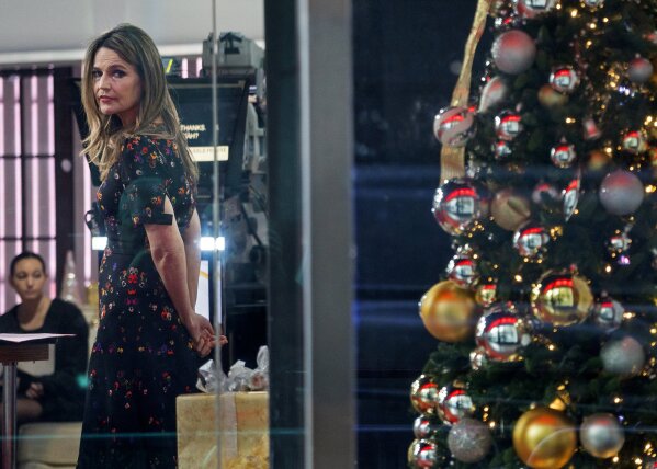 
              "Today" show host Savannah Guthrie looks out the window while on the set of the show Wednesday, Nov. 29, 2017, in New York, after NBC News fired host Matt Lauer. NBC News announced Wednesday, Nov. 29, 2017, that Lauer was fired for "inappropriate sexual behavior."  (AP Photo/Craig Ruttle)
            