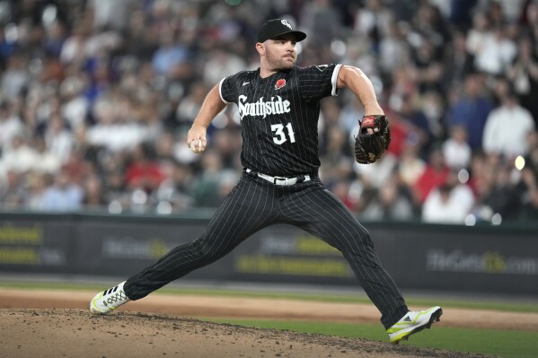 FILE - Chicago White Sox relief pitcher Liam Hendriks delivers in a baseball game against the Los Angeles Angels on May 29, 2023, in Chicago. The White Sox declined their $15 million club option on Hendriks on Friday, Nov. 3. The White Sox also said right-hander Mike Clevinger had declined his $12 million mutual option. (AP Photo/Charles Rex Arbogast, File)