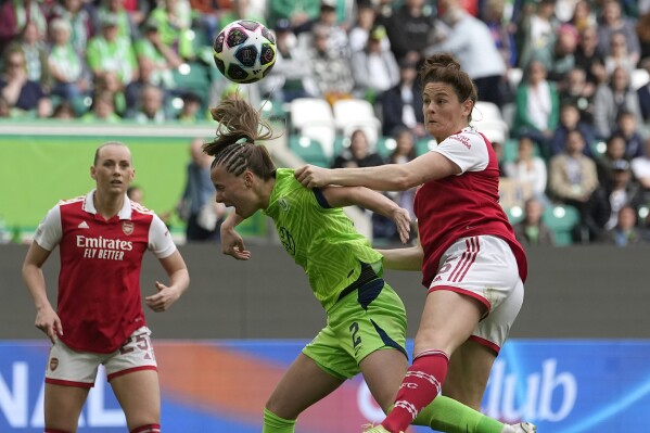 FILE - Arsenal's Jen Beattie, right, challenges for the ball with Wolfsburg's Lynn Wilms during the women's Champions League soccer semifinal first leg soccer match between VfL Wolfsburg and Arsenal WFC in Wolfsburg, Germany, Sunday, April 23, 2023. Beattie is the latest player to join the National Women's Soccer League expansion team, Bay FC. The team announced Friday, Feb. 2, 2024, it had acquired her via transfer from Arsenal in the Women's Super League. (AP Photo/Martin Meissner, File)