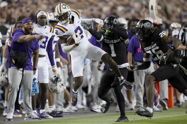 LSU wide receiver Kyren Lacy (2) is pushed out of bounds after 21 yard catch and run by Texas A&M defensive back Bryce Anderson (1) during the first half of an NCAA college football game Saturday, Oct. 26, 2024, in College Station, Texas. (AP Photo/Sam Craft)