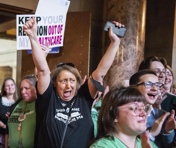 Opponents of LB626, which would have banned abortions in Nebraska after about six weeks, celebrate in the Rotunda after the bill fails to get the votes necessary to invoke cloture, Thursday, April 27, 2023, at the Nebraska State Capital in Lincoln, Neb. (Larry Robinson/Lincoln Journal Star via AP)