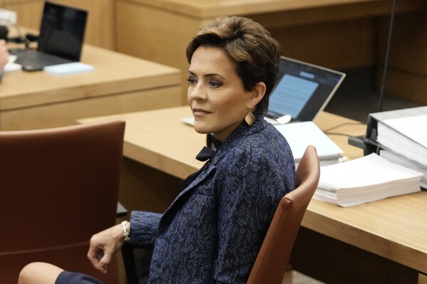 Former Arizona Republican governor candidate Kari Lake sits in court at Maricopa County Superior Court during a voting records trial Thursday, Sept. 21, 2023, in Phoenix. (AP Photo/Ross D. Franklin, Pool)