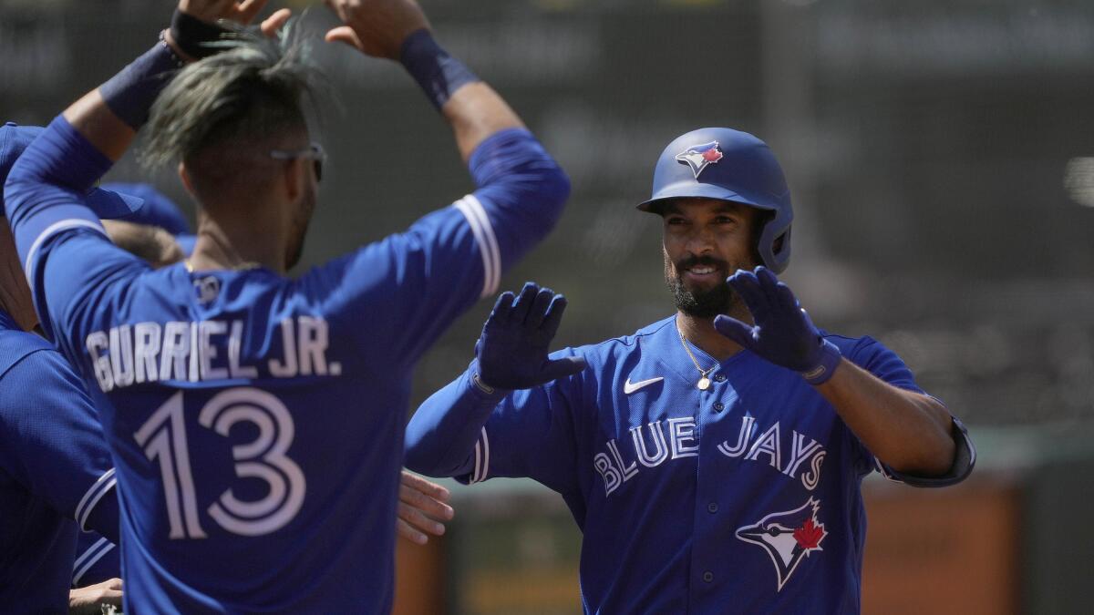 Randal Grichuk drives in 5, Jays beat A's 10-4 for series split