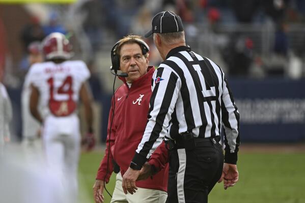 Alabama head coach Nick Saban talks with an official during the first half of an NCAA college football game against Mississippi in Oxford, Miss., Saturday, Nov. 12, 2022. (AP Photo/Thomas Graning)