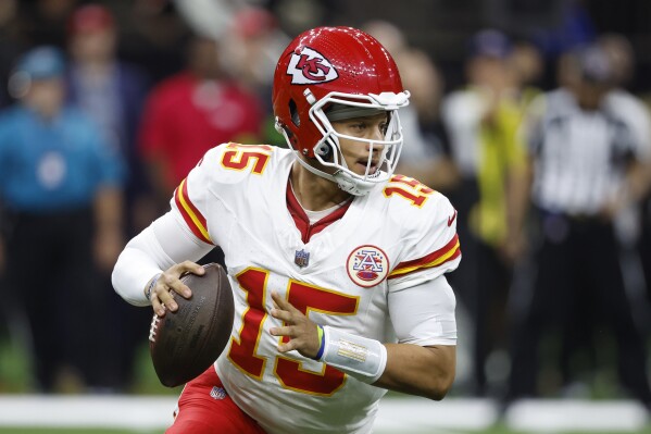 FILE - Kansas City Chiefs quarterback Patrick Mahomes (15) sets back to pass in the first half of a preseason NFL football game against the New Orleans Saints in New Orleans, Sunday, Aug. 13, 2023. It's no surprise Mahomes was an unanimous choice by The Associated Press for the top spot among quarterbacks. (AP Photo/Butch Dill, File)