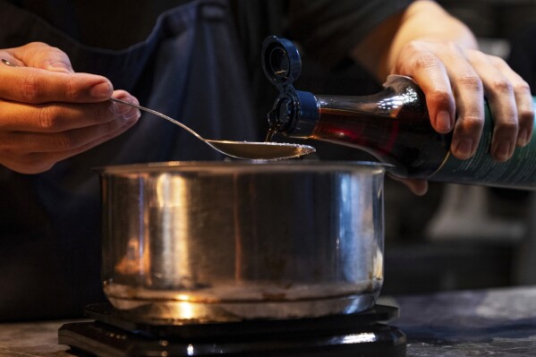 Dishes made with fish sauce are prepared at Chapter Dining, a fine dining restaurant, on March 1, 2025, in Hanoi, Vietnam. (AP Photo/Yannick Peterhans)