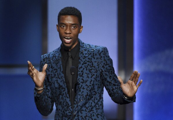 FILE - In this Thursday, June 6, 2019 file photo, Actor Chadwick Boseman addresses the audience during the 47th AFI Life Achievement Award ceremony honoring actor Denzel Washington at the Dolby Theatre in Los Angeles.  Actor Chadwick Boseman, who played Black icons Jackie Robinson and James Brown before finding fame as the regal Black Panther in the Marvel cinematic universe, has died of cancer. His representative says Boseman died Friday, Aug. 28, 2020 in Los Angeles after a four-year battle with colon cancer. He was 43. (Photo by Chris Pizzello/Invision/AP, File)