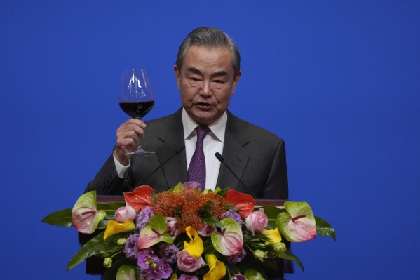 Chinese Foreign Minister Wang Yi gives a toast to invited guests after delivering a speech at a reception for Commemoration of the 45th Anniversary of China-U.S. Diplomatic Relations at the Diaoyutai Guest House in Beijing, Friday, Jan. 5, 2024. (AP Photo/Andy Wong, Pool)