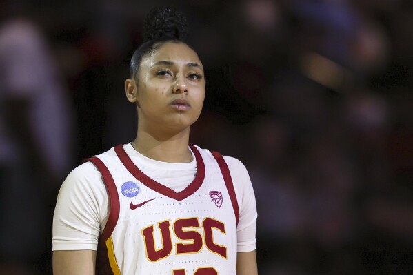 Southern California guard JuJu Watkins looks on before a Sweet 16 college basketball game against Baylor in the women's NCAA Tournament, Saturday, March 30, 2024, in Portland, Ore. Southern California won 74-70. (AP Photo/Howard Lao)