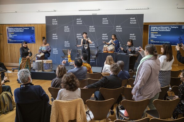 Rara Sekar, who goes by hara, right, performs at a session during the Skoll World Forum on Thursday, April 3, 2025, in Oxford, England. (AP Photo/Vickram Sombu)