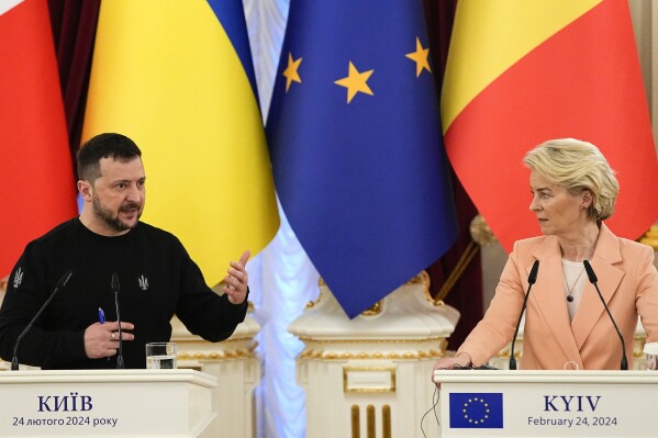 FILE - Ukrainian President Volodymyr Zelenskyy, left, speaks during a joint press conference with EU Commission President Ursula von der Leyen at Mariinsky Palace in Kyiv, Ukraine, Saturday, Feb. 24, 2024. The European Union agreed Friday, June 21, 2024, to start membership negotiations with embattled Ukraine and Moldova, another step in the nations' long journey to move closer to the West and mute Russia's influence. (AP Photo/Efrem Lukatsky, File)