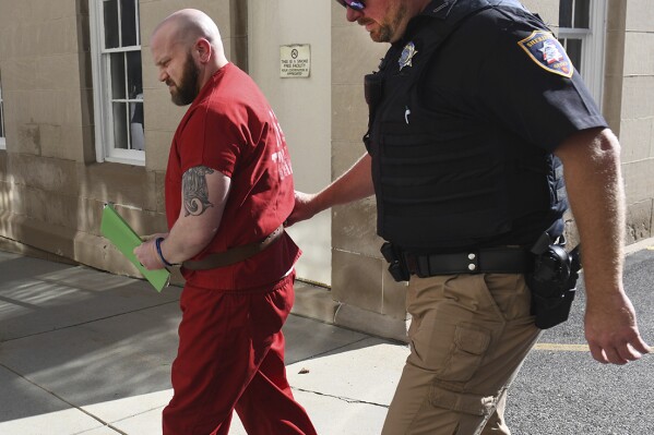 Ex Somerset County D.A. Jeffrey Thomas is escorted to his sexual assault hearing at Somerset County courthouse by Somerset County Sheriff Dept. Dusty Weir on Thursday, Aug. 17, 2023. (Todd Berkey/The Tribune-Democrat via AP)