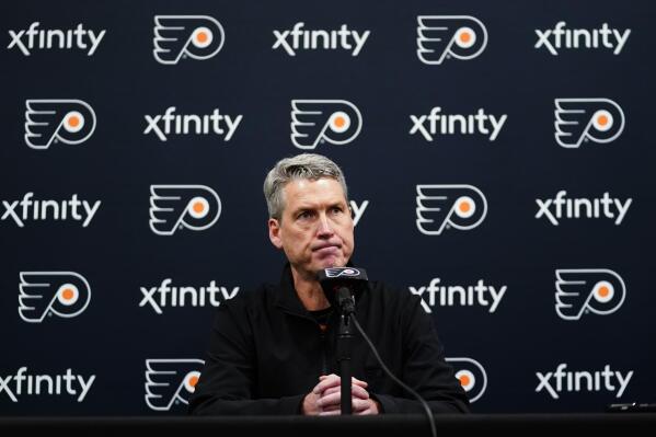 FILE - Philadelphia Flyers General Manager Chuck Fletcher pauses while speaking during a news conference at the team's NHL hockey practice facility in Voorhees, N.J., on Tuesday, Nov. 30, 2021. Before any of the top NHL free agents had signed, Fletcher declared the Flyers were out on them because of “the reality of our cap situation.” (AP Photo/Matt Slocum, File)