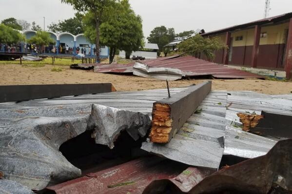 FILE - The damaged roof of a school lies in the playground in Vilanculos, Mozambique, on Feb. 24. 2023. Still recovering from the effects of the first battering, the southwestern African nation of Mozambique is bracing for a rare second hit by long-living Tropical Cyclone Freddy late on Friday night, a regional weather center said Tuesday, March 7, 2023. (AP Photo, File)