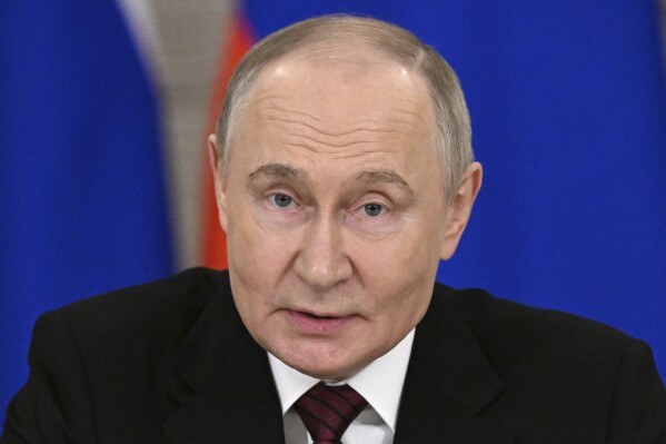 Russian President Vladimir Putin gestures as he speaks to journalists in the Grand Palace at the Kremlin in Moscow, Russia, Sunday, May 11, 2025, after celebrations of the 80th anniversary of the Soviet Union's victory over Nazi Germany during World War II. (Sergei Bobylev/Photo host agency RIA Novosti via AP)