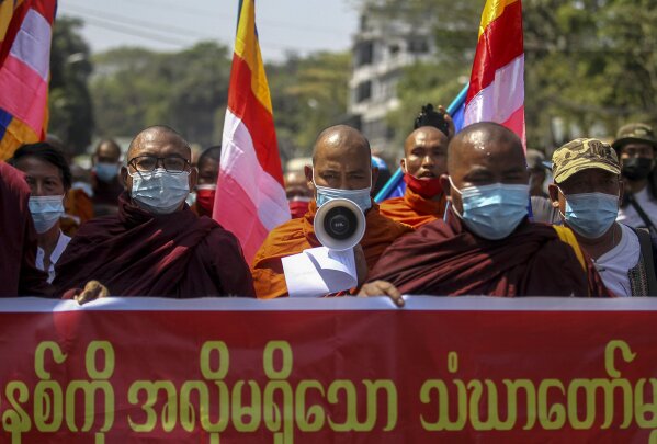 Buddhist monks march during a protest against the military coup in Yangon, Myanmar Tuesday, Feb. 16, 2021. Peaceful demonstrations against Myanmar's military takeover resumed Tuesday, following violence against protesters a day earlier by security forces and after internet access was blocked for a second straight night. (AP Photo)
