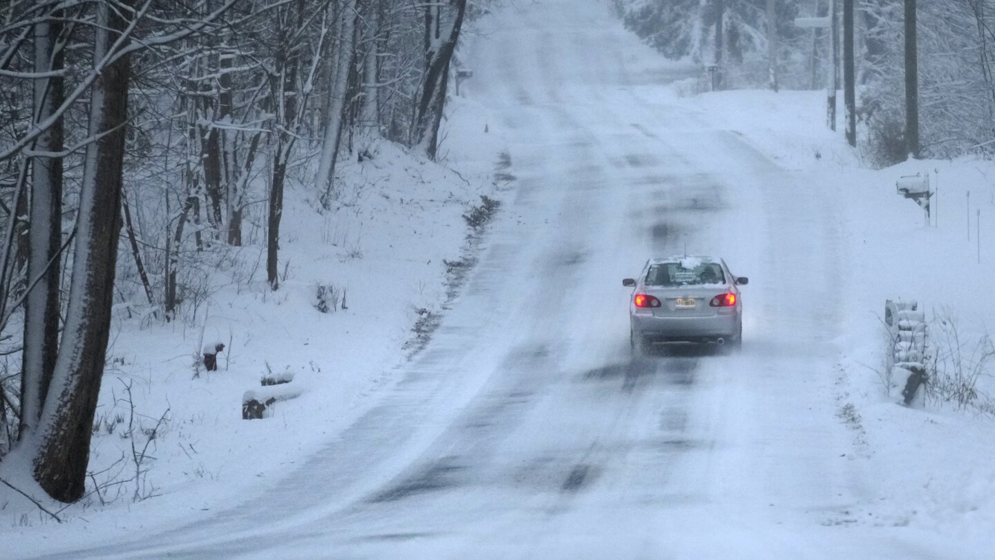 Major winter storms bring snow, ice and travel hazards to both US coasts