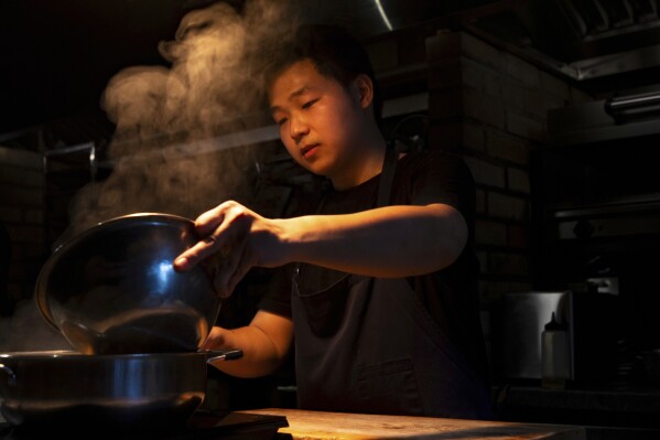 Dishes made with fish sauce are prepared at Chapter Dining, a fine dining restaurant, on March 1, 2025, in Hanoi, Vietnam. (AP Photo/Yannick Peterhans)