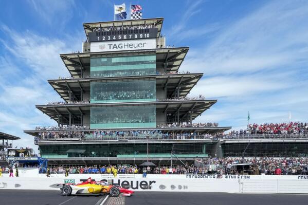 Josef Newgarden crosses the start finish line to win the Indianapolis 500 auto race at Indianapolis Motor Speedway in Indianapolis, Sunday, May 28, 2023. (AP Photo/AJ Mast)