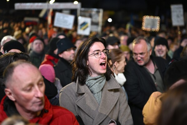 A protester shouts as thousands gather to oppose the policies of Slovakia's Prime Minister Robert Fico in Bratislava, Slovakia, Friday, Jan. 24, 2025. (AP Photo/Denes Erdos)