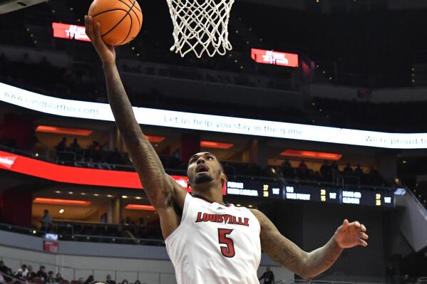 Louisville forward Malik Williams (5) goes in for a lay-up during the second half of an NCAA college basketball game against Southeastern Louisiana in Louisville, Ky., Tuesday, Dec. 14, 2021. Louisville won 86-60. (AP Photo/Timothy D. Easley)