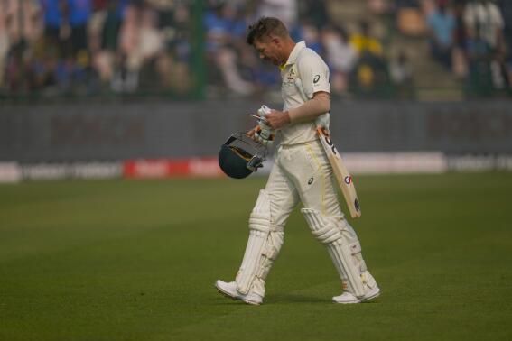 Australia's David Warner walks back to pavilion after his dismissal during the first day of the second cricket test match between India and Australia in New Delhi, India, Friday, Feb. 17, 2023. (AP Photo/Altaf Qadri)
