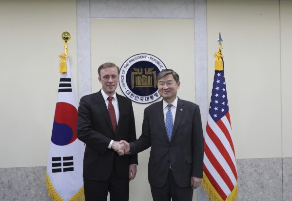 In this photo provided by South Korea Presidential Office, U.S. national security adviser Jake Sullivan, left, poses for a photo with his South Korean counterpart Cho Tae-yong during their meeting at the presidential office in Seoul, South Korea, Friday, Dec. 8, 2023. (South Korea Presidential Office via AP)