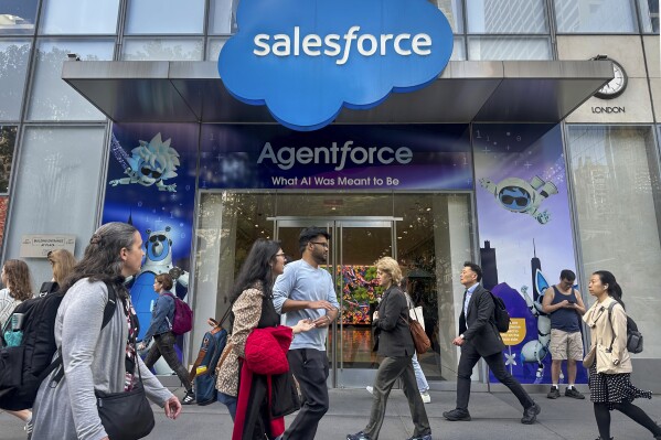 People walk past the Salesforce Tower in New York on Thursday, May 8, 2025. (AP Photo/Ted Shaffrey, File)