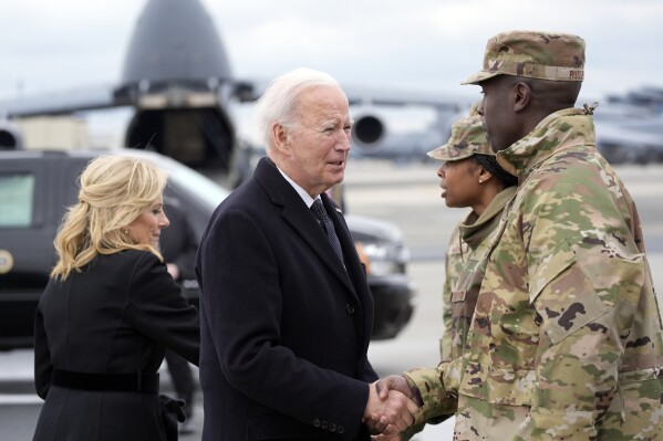 President Joe Biden and first lady Jill Biden greet service members before boarding Air Force One after attending a casualty return for Sgt. William Jerome Rivers, 46, of Carrollton, Ga., Sgt. Breonna Alexsondria Moffett, 23, of Savannah, Ga., and Sgt. Kennedy Ladon Sanders, 24, of Waycross, Ga., at Dover Air Force Base, Del., Friday, Feb. 2, 2024. The three were killed in a drone attack in Jordan on Jan. 28. (AP Photo/Alex Brandon)