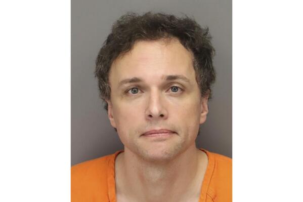 This photo provided by the Pinellas County Sheriff’s Office shows Dr. Tomasz Kosowski, who was arrested on a first-degree murder charge Saturday, March 25, 2023, by Largo Police, in Florida. The Tampa-area plastic surgeon is accused of killing a lawyer missing since last week from a firm that represents former co-workers the doctor has been suing in a business dispute. (Pinellas County Sheriff’s Office via AP)
