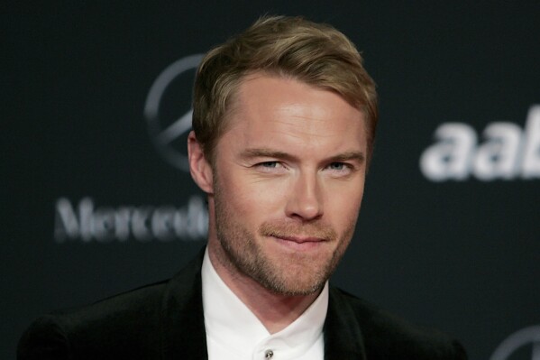 FILE - Irish singer Ronan Keating arrives for the Laureus Awards in Abu Dhabi, United Arab Emirates, on Feb. 7, 2011. Chorley could be the next soccer club from the English non-leagues to be given a sprinkle of celebrity stardust. The sixth-tier team from northwest England says it is in “ongoing discussions” with Boyzone in hopes of the Irish boy band fronted by Ronan Keating becoming “the face of the football club.” (AP Photo/Nousha Salimi, File)