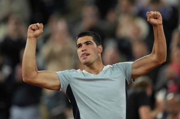 Spain's Carlos Alcaraz celebrates winning against Sebastian Korda of the U.S. in three sets, 6-4, 6-4, 6-2, during their third round match at the French Open tennis tournament in Roland Garros stadium in Paris, France, Friday, May 27, 2022. (AP Photo/Thibault Camus)
