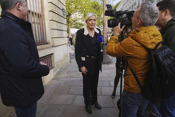 Le Pen awaits court verdict which could end her presidential election bid | AP News