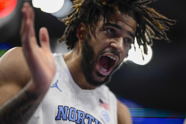 North Carolina guard RJ Davis (4) reacting to a play against Pittsburgh during the second half of an NCAA college basketball game in the semifinal round of the Atlantic Coast Conference tournament Friday, March 15, 2024, in Washington. (AP Photo/Nick Wass)