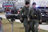 Police respond to Perry High School in Perry, Iowa, on Thursday, Jan. 4, 2024. Police say there has been a shooting at the city's high school.  (AP Photo/Andrew Harnik)