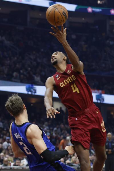 Mitchell scores 34, Cavaliers top Magic 107-96