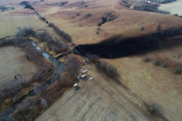 FILE - In this photo taken by a drone, cleanup continues in the area where the ruptured Keystone pipeline dumped oil into a creek in Washington County, Kan., on Dec. 9, 2022. A faulty weld at a bend in an oil pipeline contributed to a spill that dumped nearly 13,000 bathtubs' worth of crude oil into a northeastern Kansas creek, the pipeline's operator said Thursday, Feb. 9, 2023, estimating the cost of cleaning it up at $480 million. (DroneBase via AP, File)