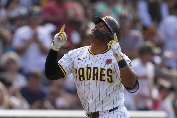 San Diego Padres' Donovan Solano celebrates after hitting a home run during the second inning of a baseball game against the Miami Marlins Monday, May 27, 2024, in San Diego. (AP Photo/Gregory Bull)