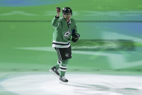 Dallas Stars center Mikael Granlund (64) skates on the ice after earning a hat trick in Game 4 of a second-round NHL hockey playoff series against the Winnipeg Jets in Dallas, Tuesday, May 13, 2025. (AP Photo/Gareth Patterson)